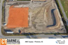 Thumbnail for Aerial view of a construction site with cleared land and excavation in Florence, SC by CT Darnell Construction.
