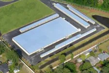 Thumbnail for Aerial view of a large warehouse complex with multiple long slim storage units and surrounding greenery.