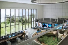 Thumbnail for Modern office space with large windows, curved workstations, multiple monitors, and people collaborating inside.