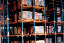 Thumbnail for Warehouse racks filled with stacked pallets of packaged goods in an industrial storage facility.