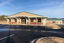 Thumbnail for Centerville Public Works Department building with parking lot and clear blue sky in the background