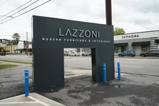 Thumbnail for Black Lazzoni modern furniture and interiors sign with a Sephora store and street in the background
