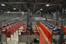Thumbnail for Interior view of a spacious industrial welding workshop with multiple welding stations and ventilation systems.