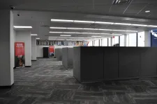 Thumbnail for Modern office space with cubicles, carpeted floor, and motivational sign reading Your Future Starts Here