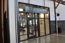 Thumbnail for Modern gym storefront with large glass doors and sign reading Stellar Bodies fitness training studio.