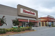 Thumbnail for Exterior view of a HomeGoods store with clear signage and landscaped entrance under a cloudy sky.