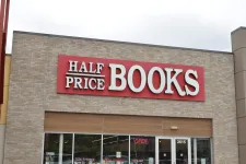 Thumbnail for Half Price Books store front with red sign and glass windows showing book sections inside