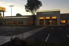 Thumbnail for Havertys furniture store at dusk with illuminated signage and empty parking lot in front.