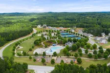 Thumbnail for a large green landscape with trees and buildings