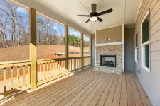 Thumbnail for a wood deck with a fireplace and a wood railing with a wood railing