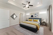 Thumbnail for a bedroom with a bed and a fan