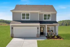 Thumbnail for Modern two-story gray house with large garage, porch seating, and a fresh green lawn on a sunny day