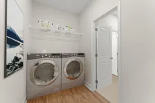 Thumbnail for a room with a washing machine and a door