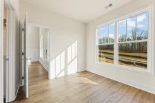 Thumbnail for a room with a wood floor and a large window