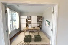 Thumbnail for a room with a table and bookshelves