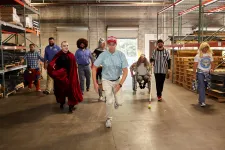 Thumbnail for a group of people walking in a warehouse