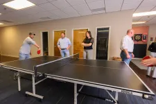 Thumbnail for a group of people playing ping pong