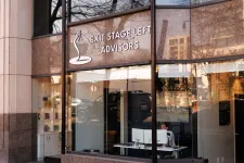 Thumbnail for Modern office building exterior with large glass windows and EXIT STAGE LEFT ADVISORS sign.