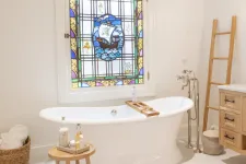 Thumbnail for a bathtub with a window above it