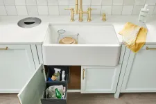 Thumbnail for a white sink with a towel from it