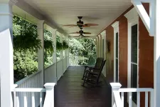 Thumbnail for a porch with a wood railing and a wood deck with a chair and a wood railing and a