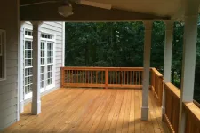 Thumbnail for a wooden deck with a railing and a wood railing