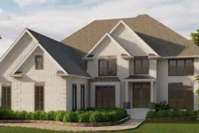 Thumbnail for Large two-story white brick house with multiple gable roofs and large windows surrounded by greenery.