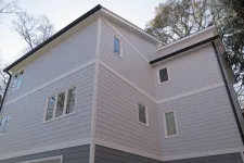 Thumbnail for a grey house with a tree in the front
