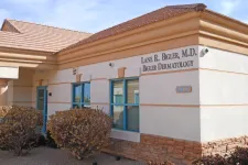 Thumbnail for Exterior view of Lane R. Bigler M.D. Dermatology office building with beige walls and blue windows.