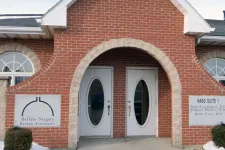 Thumbnail for Brick building entrance with double oval glass doors and Buffalo-Niagara Retina Associates signage.