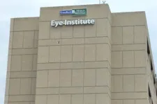 Thumbnail for Exterior view of a beige Eye Institute building with Freeport and Mercy Medical Center signage on top.