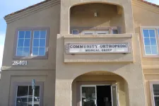 Thumbnail for Exterior view of Community Orthopedic Medical Group building with address 26401 and entrance door.
