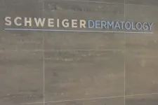 Thumbnail for Schweiger Dermatology logo displayed on a gray tiled wall with beige and blue lettering.