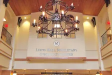 Thumbnail for Interior of Lewis Hall Singletary Oncology Center with chandelier and high ceiling.