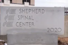 Thumbnail for Stone sign for Shepherd Spinal Center with logo and founding dates outside a building.