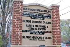 Thumbnail for Outdoor medical office sign listing skin cancer specialists, children’s orthopaedics, family dental, and healthcare services.