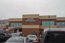 Thumbnail for Rockhill Orthopaedics medical office building with parked cars in front on a cloudy day.