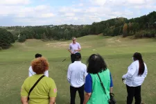 Thumbnail for a group of people on a golf course
