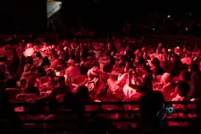 Thumbnail for a group of people performing on stage in front of a crowd