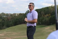 Thumbnail for a man holding a golf club
