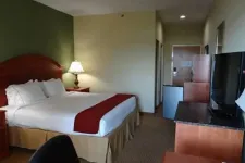 Thumbnail for a hotel room with a bed and a tv