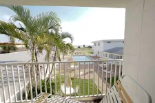 Thumbnail for a balcony with a palm tree and a pool
