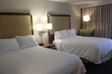 Thumbnail for a hotel room with two beds