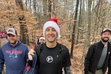 Thumbnail for a group of people walking on a trail in the woods