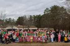 Thumbnail for a group of people holding a sign