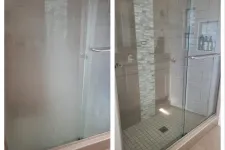 Thumbnail for Before and after images of a shower door showing buildup removal and clear glass restoration from MaidPro Arvada