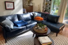 Thumbnail for a living room with a black couch