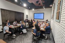 Thumbnail for a group of people sitting around a table