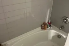 Thumbnail for a bathtub with a sink and a shower unit