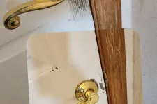 Thumbnail for Before and after cleaning of a white door with brass handle and wooden frame showing removed dirt and stains.